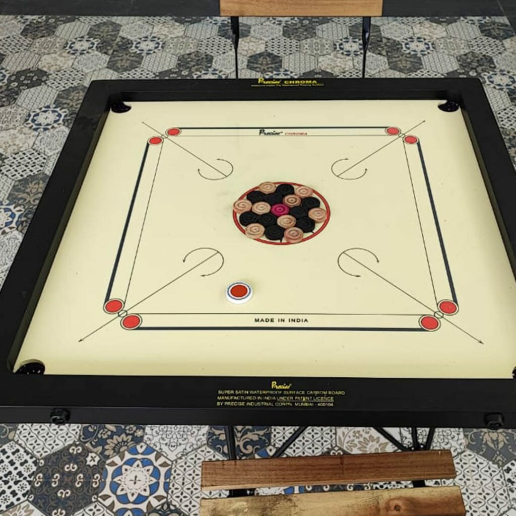 Classic carrom board setup at Le Jardin Resort & Spa, Karjat, perfect for indoor fun and friendly competition.